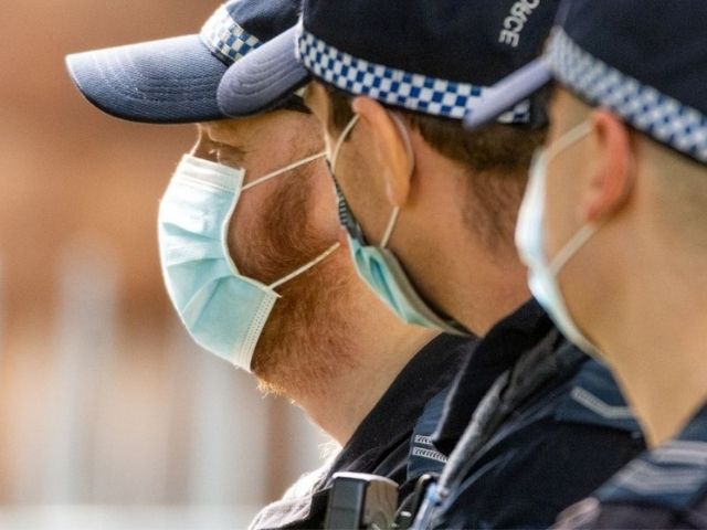 Three NSW Police officers wearing face masks.