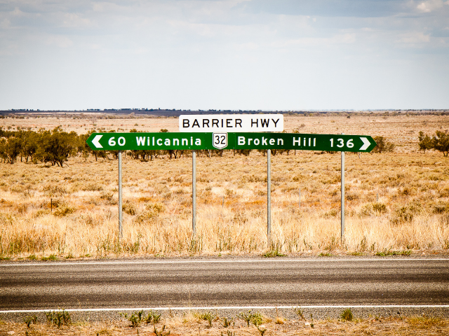 A road sign pointing to Broken Hill and Wilcannia.
