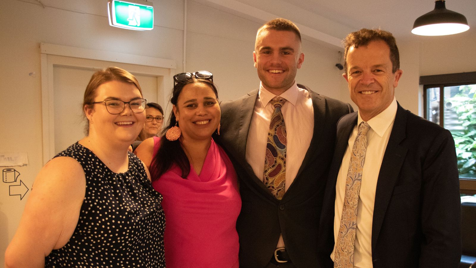 Celebrating the renewal of the First Nations Cadetship Program: Tonkya Jamieson (First Nations Cadet), Bobbi Murray (First Nations Cadetship Program Administrator), Oliver John Williams (First Nations Cadet), and Attorney General Mark Speakman.