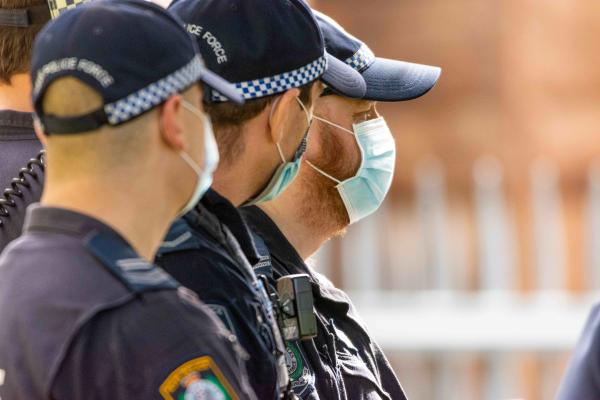 NSW Police wearing face masks, standing in a row.