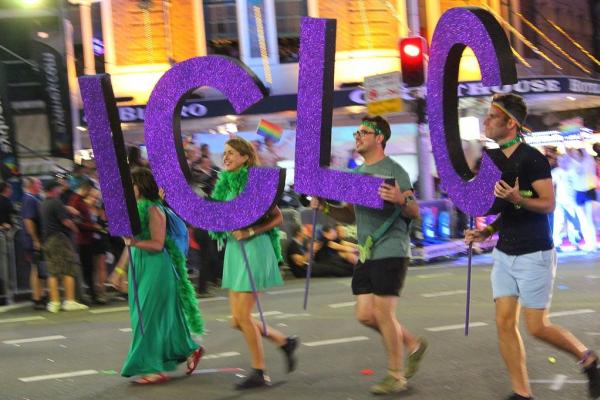 ICLC staff march in the Mardi Gras parade.