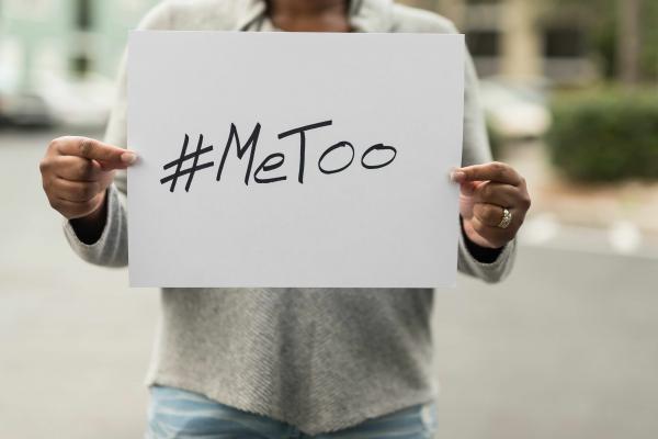 A person holding a #MeToo sign. 